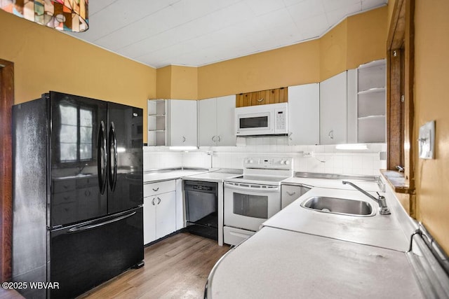 152 Carpenter St, Dushore, PA 18614 - kitchen with black appliances, light wood-style floors, light countertops, white cabinetry, and open shelves