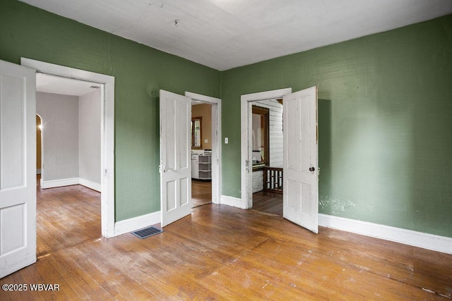 152 Carpenter St, Dushore, PA 18614 - unfurnished room with wood finished floors and arched walkways