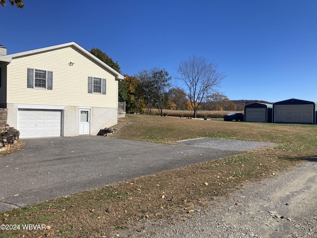 view of property exterior featuring driveway and a chimney