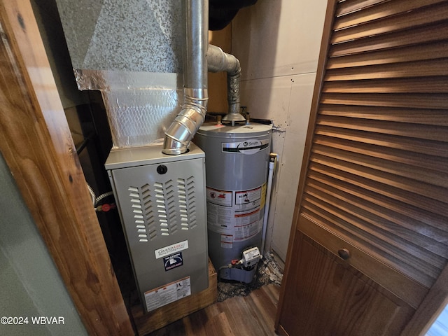 utility room featuring gas water heater