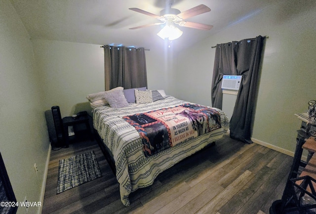 bedroom featuring cooling unit, dark hardwood / wood-style floors, ceiling fan, and lofted ceiling