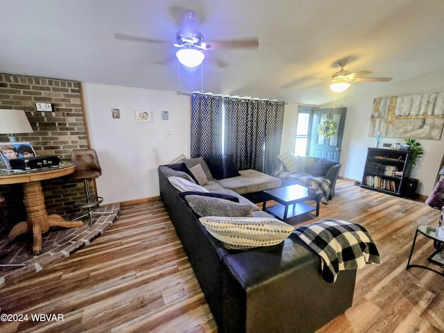 living room with ceiling fan and wood-type flooring