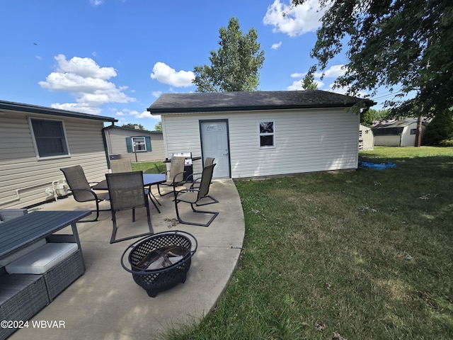 view of patio / terrace featuring a shed and an outdoor fire pit