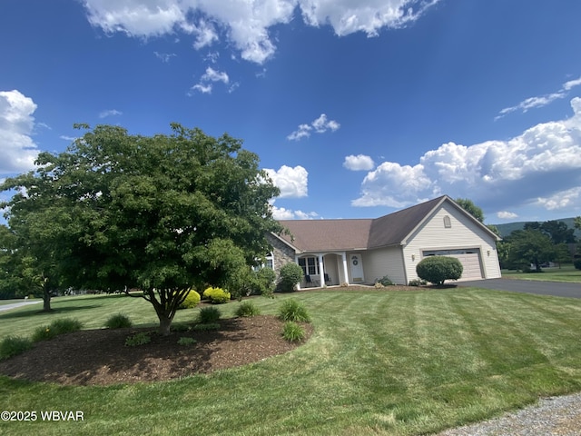 29 S Parsons Dr, Mill Hall, PA 17751 - ranch-style house featuring asphalt driveway, an attached garage, and a front lawn