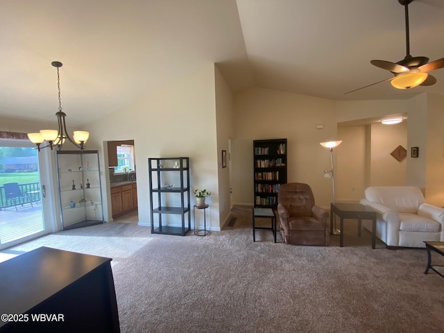 29 S Parsons Dr, Mill Hall, PA 17751 - living room featuring light colored carpet, lofted ceiling, a ceiling fan, and a chandelier