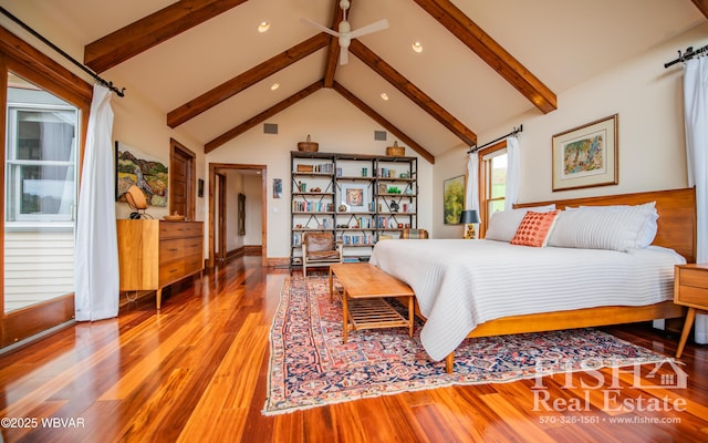 bedroom with beamed ceiling, hardwood / wood-style flooring, and high vaulted ceiling