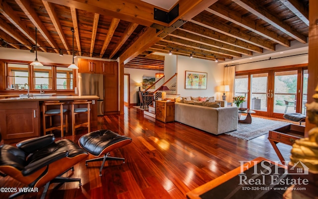 living room featuring french doors, track lighting, wooden ceiling, beamed ceiling, and hardwood / wood-style floors