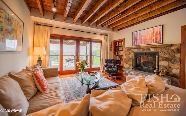 living room featuring french doors, a fireplace, wood ceiling, wood-type flooring, and beamed ceiling