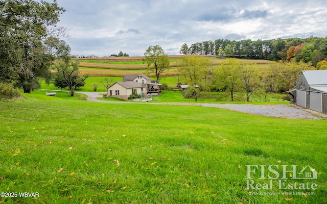 view of yard with a rural view