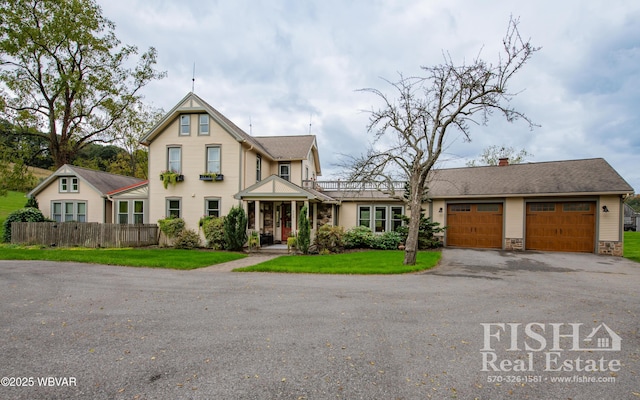 view of front of home with a garage and a front yard