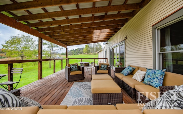 wooden deck featuring outdoor lounge area and a yard