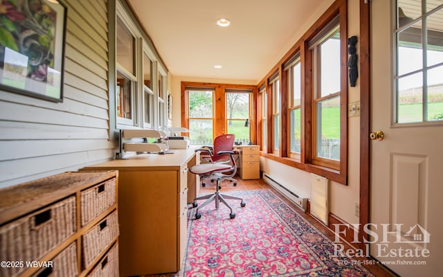 tiled home office with baseboard heating and wood walls