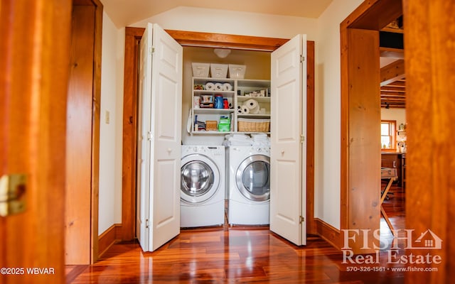 laundry area with washer and dryer and hardwood / wood-style floors