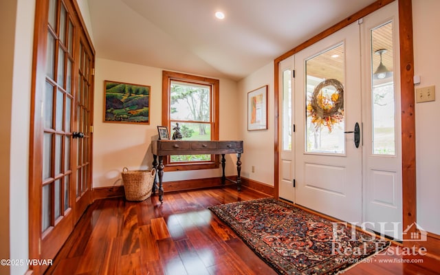 entrance foyer featuring hardwood / wood-style flooring and lofted ceiling