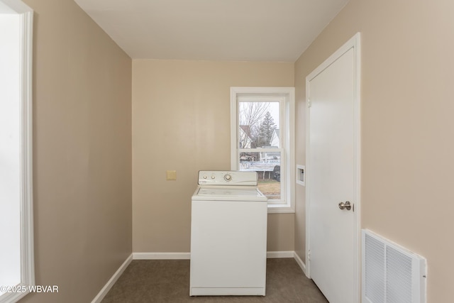 washroom with washer / dryer and dark colored carpet