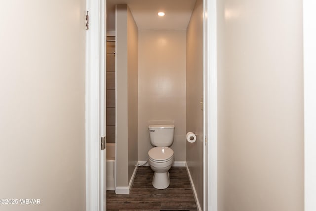 bathroom featuring hardwood / wood-style flooring and toilet