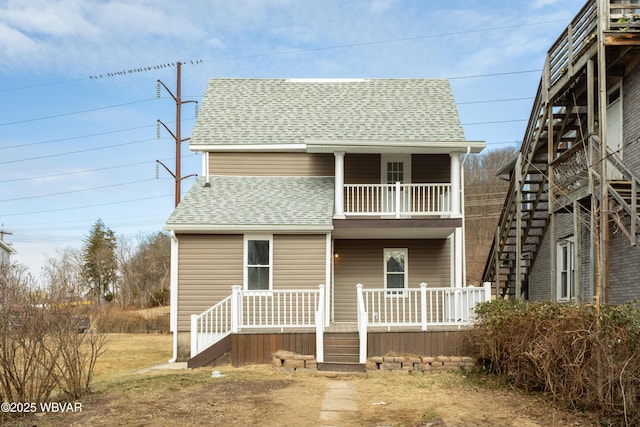 view of front of house with a balcony