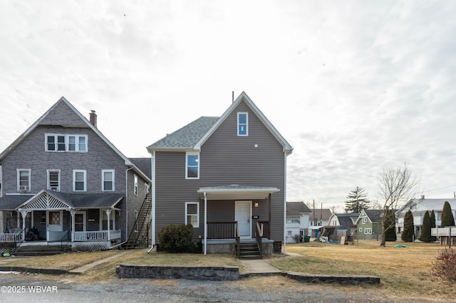 view of front of house featuring a front yard and a porch