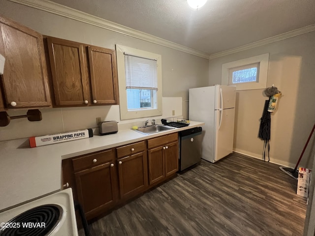 kitchen with stainless steel dishwasher, white fridge, crown molding, and sink