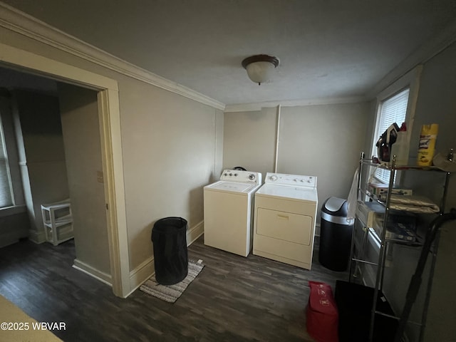 laundry room with dark hardwood / wood-style flooring, crown molding, and washer and clothes dryer