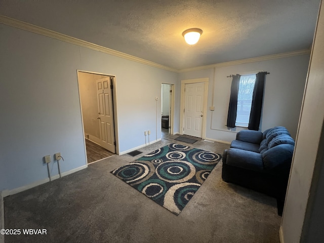 living area featuring dark colored carpet, a textured ceiling, and crown molding