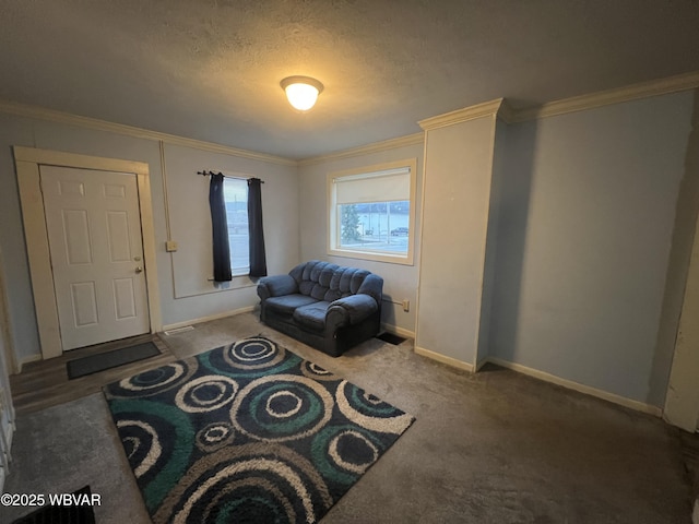 sitting room featuring a textured ceiling, dark carpet, and crown molding