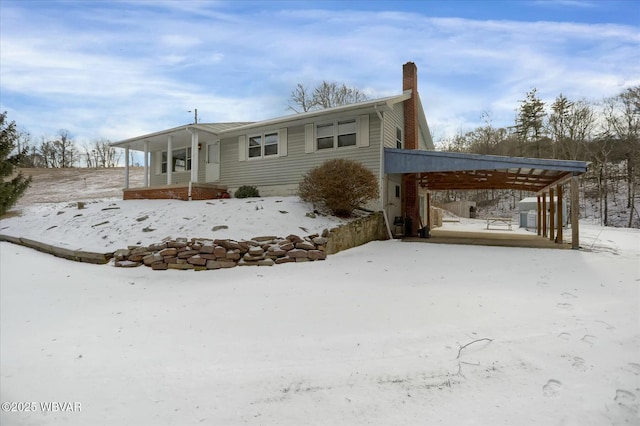 view of front facade with a carport