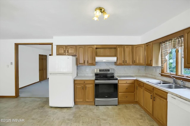 kitchen featuring sink and white appliances