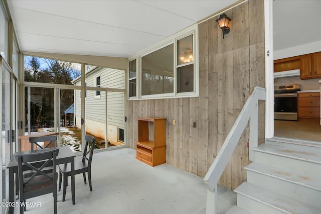 sunroom / solarium with lofted ceiling