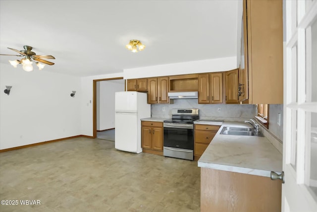 kitchen featuring ceiling fan, sink, stainless steel range oven, ventilation hood, and white fridge