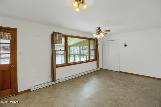 empty room with ceiling fan and a baseboard radiator