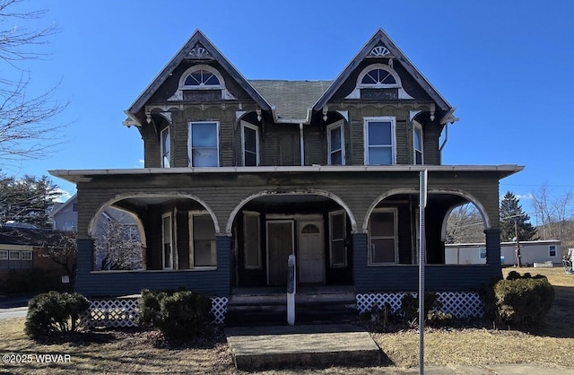 victorian-style house featuring covered porch