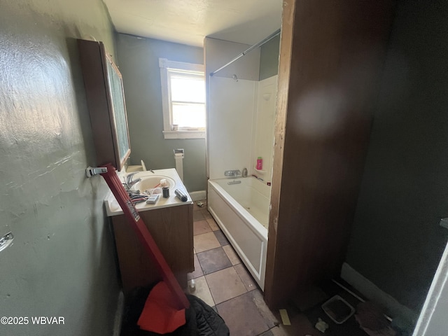 full bathroom with tile patterned floors, washtub / shower combination, and vanity