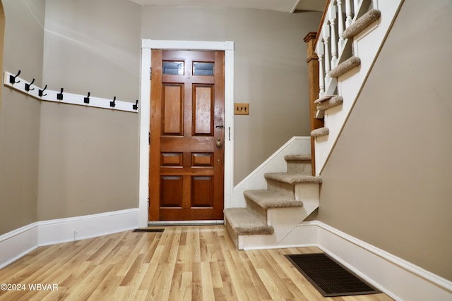 foyer with light hardwood / wood-style floors