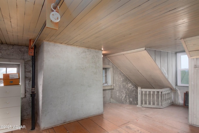 320 Carpenters Ln, Pennsdale, PA 17756 - additional living space featuring wood-type flooring, plenty of natural light, wooden ceiling, and a wood stove