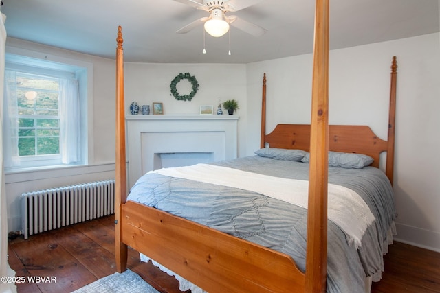 320 Carpenters Ln, Pennsdale, PA 17756 - bedroom featuring radiator heating unit, hardwood / wood-style floors, ceiling fan, and baseboards