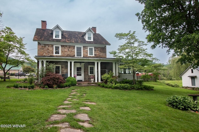 320 Carpenters Ln, Pennsdale, PA 17756 - view of front facade with stone siding, a chimney, a front yard, and a porch