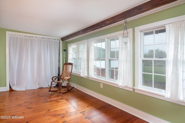 320 Carpenters Ln, Pennsdale, PA 17756 - unfurnished room featuring wood-type flooring, healthy amount of natural light, baseboards, and beam ceiling