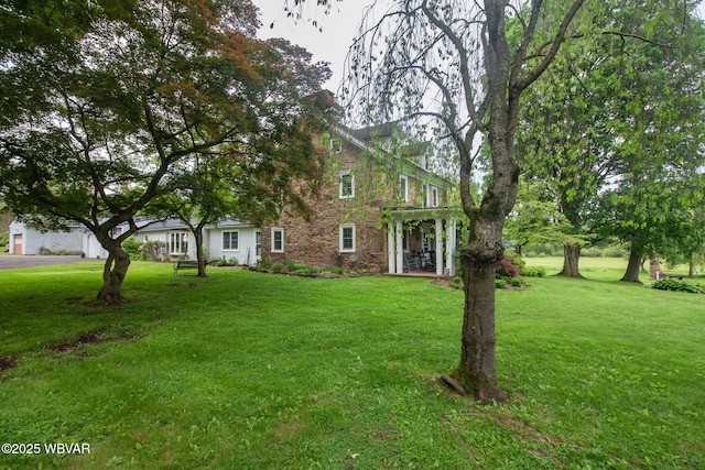 320 Carpenters Ln, Pennsdale, PA 17756 - view of front facade featuring stone siding and a front yard