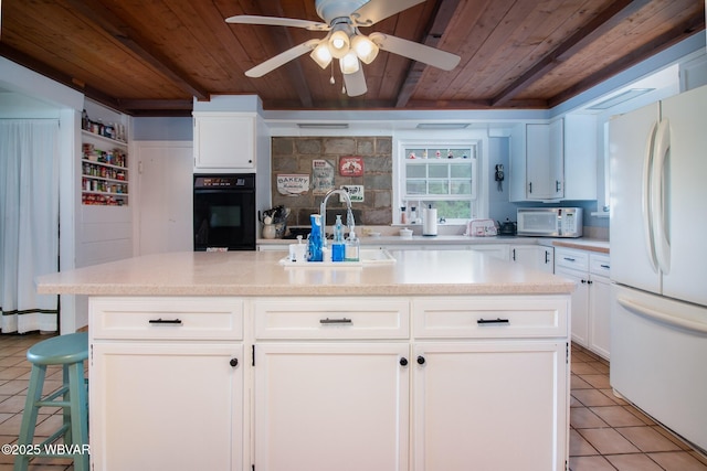 320 Carpenters Ln, Pennsdale, PA 17756 - kitchen with freestanding refrigerator, wood ceiling with exposed beams, black oven, light tile patterned flooring, and a ceiling fan