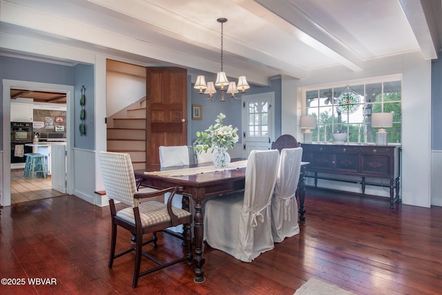 320 Carpenters Ln, Pennsdale, PA 17756 - dining space featuring dark wood finished floors, a chandelier, stairs, healthy amount of natural light, and beamed ceiling