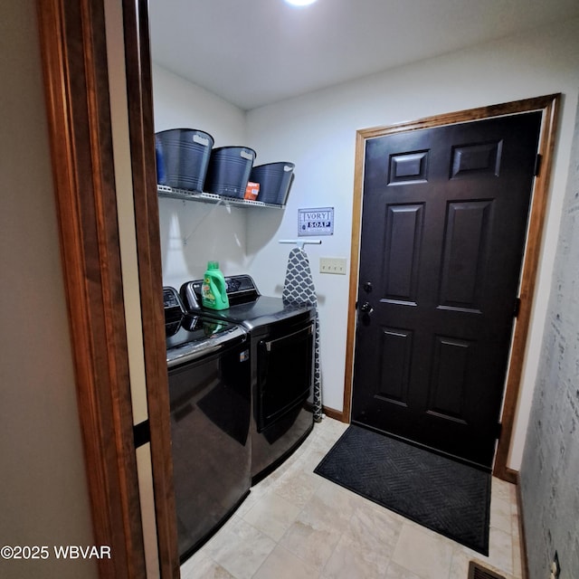 laundry room featuring washer and dryer and laundry area