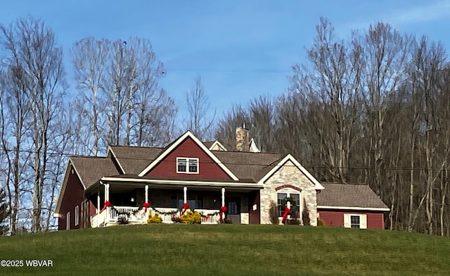 685 Park Rd, Wellsboro, PA 16901 - view of front of property with stone siding, covered porch, a chimney, and a front yard