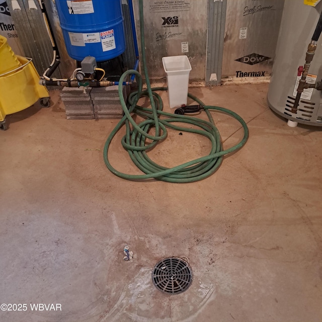 details featuring concrete floors and water heater