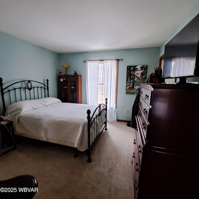 carpeted bedroom with baseboards