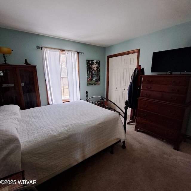 carpeted bedroom with a closet