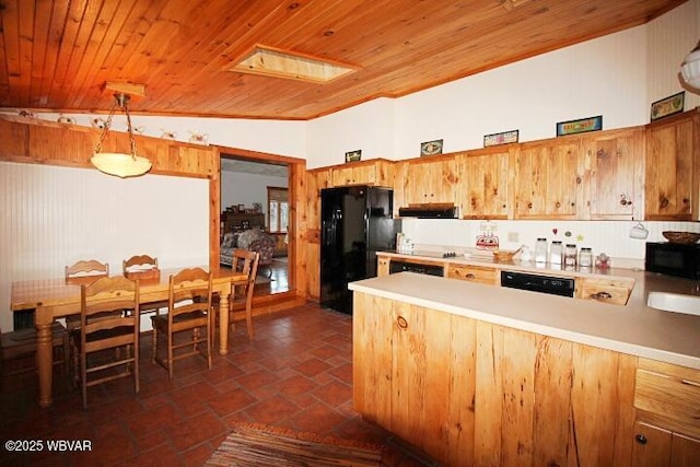 kitchen with lofted ceiling with skylight, kitchen peninsula, decorative light fixtures, wood ceiling, and black appliances