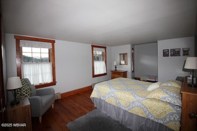 bedroom with dark wood-type flooring