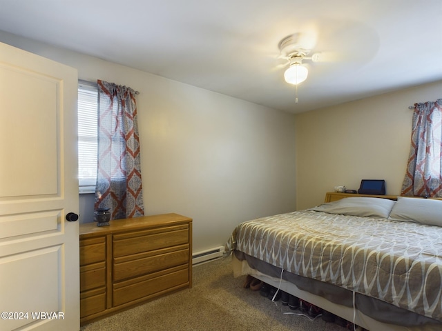 carpeted bedroom featuring baseboard heating and ceiling fan