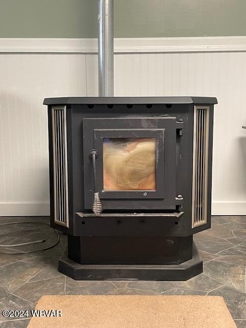 interior details featuring a wood stove